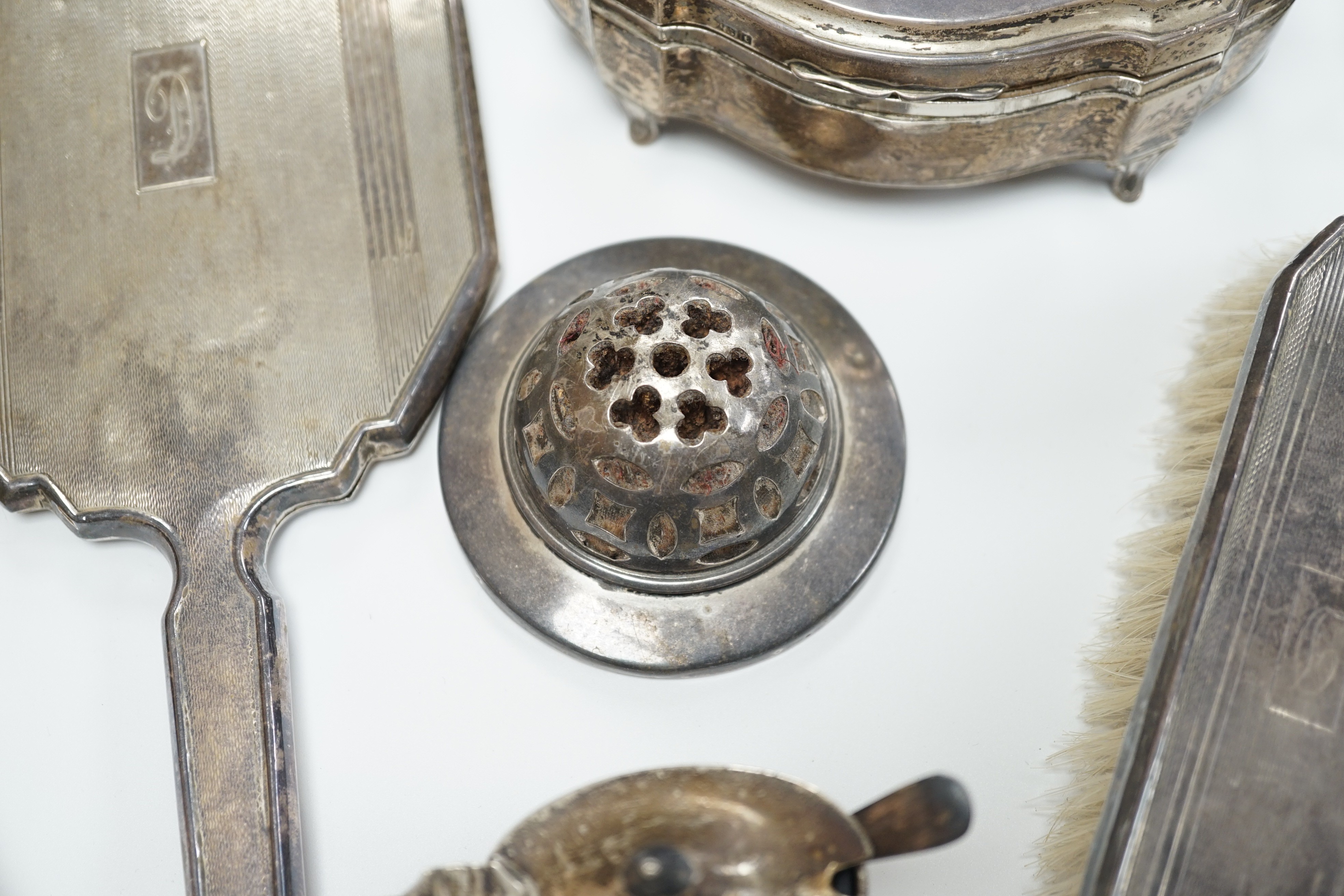 A George V silver mounted trinket box, Elkington & Co, Birmingham, 1918, 13.1cm, a silver mustard pot, two Scandinavian 925 condiments, two silver mounted scent bottles, hatpins and hatpin stand and a silver mounted thre